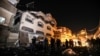 Palestinians inspect the damaged house of Islamic Jihad leader Baha Abu Al-Ata after an Israeli attack in Gaza city, on November 12, 2019. 