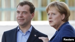 Russian President Dmitry Medvedev and German Chancellor Angela Merkel at the government guest house Schloss Meseberg, north of Berlin, on June 4.