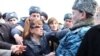 Armenia - Opposition MP Zaruhi Postanjian scuffles with a police officer, Yerevan,03Mar2011.