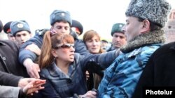 Armenia - Opposition MP Zaruhi Postanjian scuffles with a police officer, Yerevan,03Mar2011.