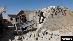 دا د کوټې په سره غړګۍ سیمه کې هغه کور دی چې د ځايي خلکو په وینا په ډرون برید لګېدلی دی. 