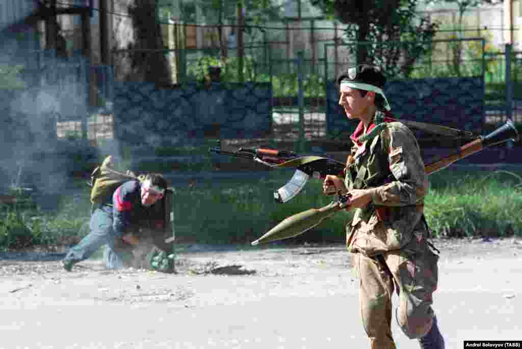 Abkhaz fighters during the attack on Sukhumi. Shortly after taking this picture, Russian photojournalist Andrei Solovyov (who took five of the other photos in this gallery) was shot dead by a sniper.