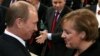 Russian President Vladimir Putin talks to German Chancellor Angela Merkel during the 43rd Munich Conference on Security Policy in 2007, the only time the Kremlin leader attended the event. 