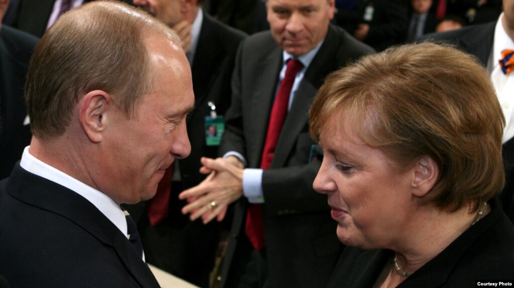 Russian President Vladimir Putin talks to German Chancellor Angela Merkel during the 43rd Munich Conference on Security Policy in 2007, the only time the Kremlin leader attended the event.