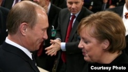 Russian President Vladimir Putin talks to German Chancellor Angela Merkel during the 43rd Munich Conference on Security Policy in 2007, the only time the Kremlin leader attended the event. 