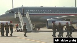 The bodies of three Czech soldiers killed in a suicide attack in Afghanistan were returned to Prague on August 8 in a ceremony marking the deadliest incident involving the army's foreign missions in four years.
