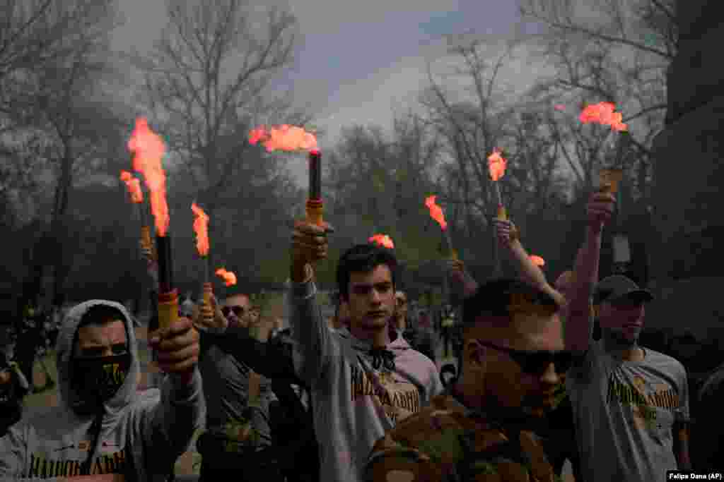 Members of nationalist movements attend a rally to commemorate the seven-year anniversary of deadly clashes that killed dozens of demonstrators in Odesa, Ukraine, on May 2. A total of 48 people died in the 2014 clashes between Ukrainian government supporters and pro-Russia protesters, including dozens who died in a burning building. (AP/Felipe Dana)