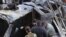 Syria -- Syrian pro-government forces inspect the damage following suicide bombings in the area of a revered Shiite shrine in the town of Sayyida Zeinab, on the outskirts of the capital Damascus, on January 31, 2016. The Islamic State group claimed respon