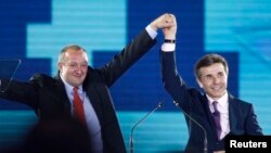 Giorgi Margvelashvili (left), presidential candidate from the ruling Georgian Dream coalition, and Prime Minister Bidzina Ivanishvili wave to supporters during an election rally in Tbilisi in September. 