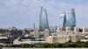 A view of the capital with the city&#39;s modern landmark, the 190-meter-high Flame Towers, dominating the skyline during a powerboat race in Baku.