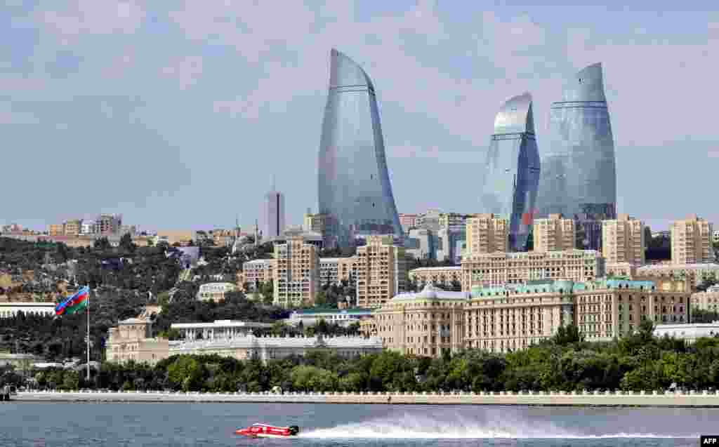 A view of the capital with the city's modern landmark, the 190-meter-high Flame Towers, dominating the skyline during a powerboat race in Baku.