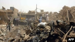 The aftermath of the bombing in Kirkuk on June 20, in which 73 people died