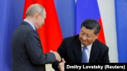 Președintele rus Vladimir Putin și președintele chinez Xi Jinping 