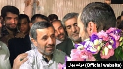 Former president Mahmoud Ahmadinejad (L) meeting with his close aide Hamid Baghaei just after his release from detention, on July 26, 2017.