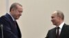 RUSSIA -- Russian President Vladimir Putin (R) and Turkish President Recep Tayyip Erdogan shake hands following a press conference at the Bocharov Ruchei state residence in Sochi, November 13,2017