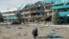 An inspector surveys the damage at a grain port facility after an attack by Russian military drones in Izmayil, in Ukraine's Odesa region, on August 2.