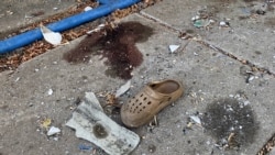 Personal items litter the site where a Russian missile hit a queue of pensioners in the village of Yarova on September 9.