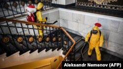 Servicemen of Russia's Emergencies Ministry disinfect a railway terminal in Moscow.