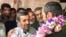 Iranian former president Mahmoud Ahmadinejad (L) greeting his close aide Hamid Baghaei just after his release from detention, on July 26, 2017.