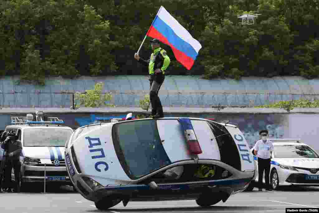 Members of a Russian stunt team perform on Traffic Police Day. (TASS/Vladimir Gerdo)