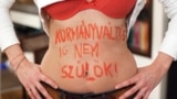 A photo from Zsuzsanna Simon's series, in which women wrote "I will not give birth until there's a change in government" -- or something similar -- on their bodies.
