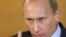 Russian Prime Minister Vladimir Putin speaks with CNN