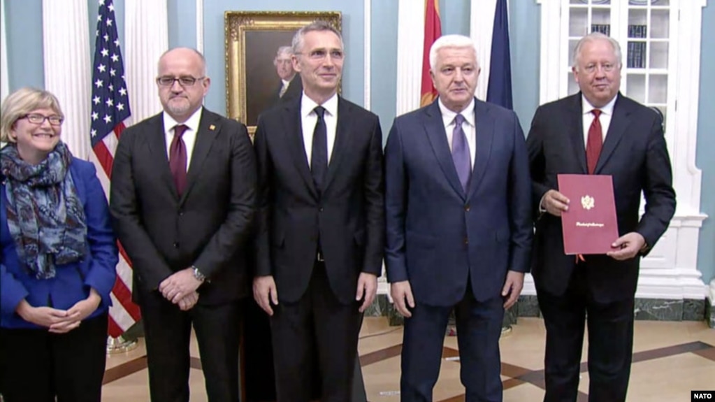 Montenegrin Prime Minister Dusko Markovic (second from right) and NATO Secretary-General Jens Stoltenberg (center) participate in the ceremony to welcome Montenegro as the alliance’s newest member in Washington on June 5.