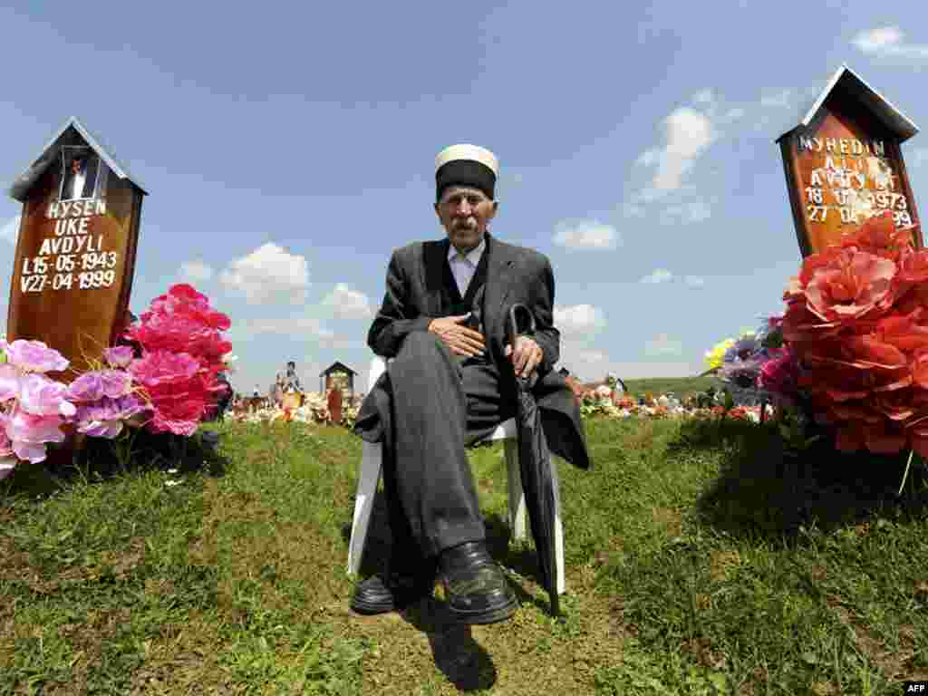 A Kosovo Albanian man attends a ceremony to mark the Day of Missing Persons on April 27 at a cemetery in the village of Meje, where a 1999 massacre by Serb forces left some 400 civilians dead. Photo by Armend Nimani for AFP