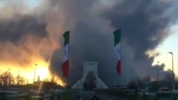 Tehran's Landmark Azadi Tower Seen Surrounded By Smoke And Flames