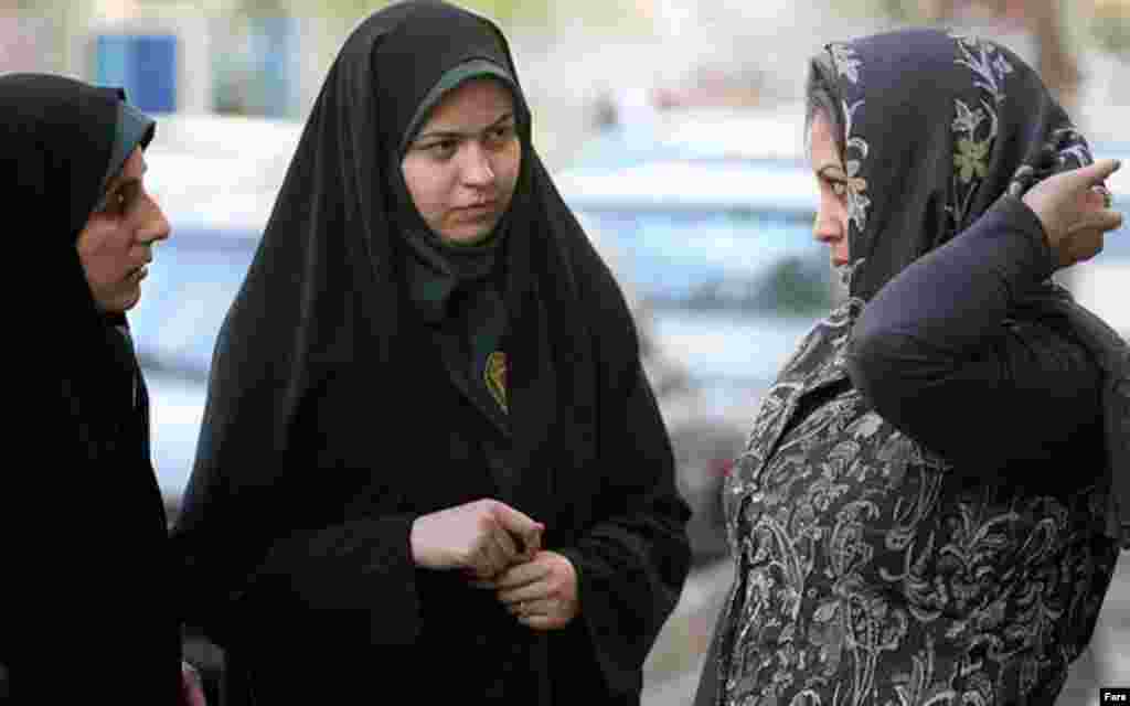 Police and Basij activists check women for proper dress in Tehran on April 22 (Fars) - Iran's main reformist student group has also criticized the crackdown and called on authorities to stop it. The group said measures to impose a strict Islamic dress code will not work, adding that authorities cannot "inject" a culture into society.