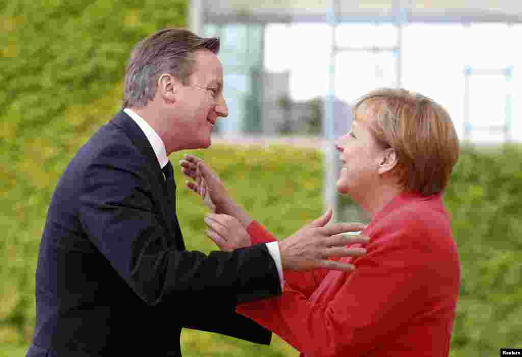 German Chancellor Angela Merkel welcomes British Prime Minister David Cameron to the Chancellery in Berlin, Germany, on June 24. (Reuters/Axel Schmidt)