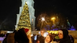 People celebrate the New Year's Eve in Kyiv.
