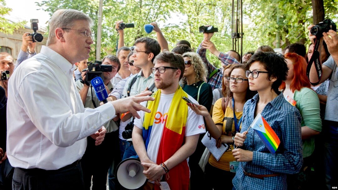 EU Commissioner for Enlargement and European Neighborhood Policy Stefan Fuele greets members of the LGBT community during a march for human rights in downtown Chisinau on May 19.