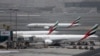 FILE photo - An Emirates Airline plane taxis at the Dubai airport in the United Arab Emirates.