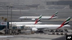 An Emirates Airline plane taxis at the Dubai airport in the United Arab Emirates, Wednesday, May 9, 2018. (AP Photo/Kamran Jebreili)