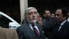 Afghan presidential candidate Abdullah Abdullah leaves a gathering after declaring victory on February 18.