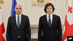 Council of Europe Secretary-General Alain Berset (left) and Georgian Prime Minister Irakli Kobakhidze pose for a photo during their meeting in Tbilisi on December 18.