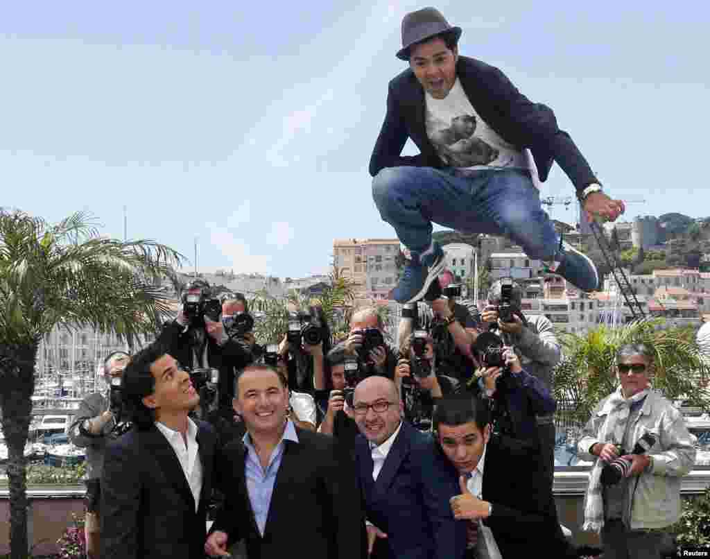 The cast members of the film &quot;Ne Quelque Part&quot; pose during a photocall at the Cannes Film Festival. (Reuters/Yves Herman)