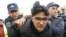 Police detain an activist in Baku ahead of the protest.