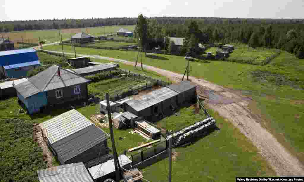 An aerial view of some village houses.