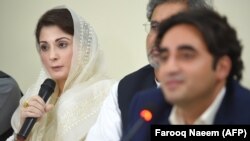 FILE: Pakistani opposition leader Bilawal Bhutto-Zardari, Chairman Pakistan Peoples Party (PPP) listens to Maryam Nawaz (L), daughter of currently incarcerated former Prime Minister Nawaz Sharif during a press conference in May.