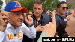 Armenia - Prime Minister Nikol Pashinian argues with an angry citizen in Yerevan, May 18, 2026.