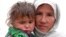 A woman and her child await their turn to get drinking water from a community tap in Baghlan, in northern Afghanistan, earlier this month. Years of conflict and drought have left large sections of the populations without access to clean water.