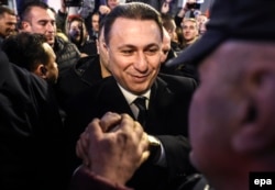 Former Macedonian prime minister and leader of the conservative VMRO-DPMNE party Nikola Gruevski celebrates elections results with supporters in Skopje on December 12.