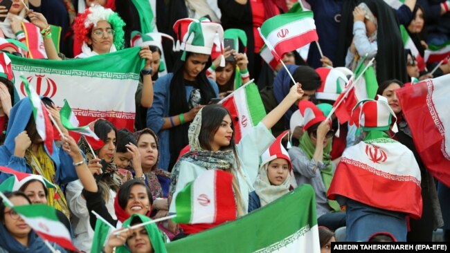 Iranian women cheer during the FIFA World Cup qualification match between Iran and Cambodia, at the Azadi stadium in Tehran, Iran 10 October 2019.
