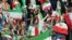 Iranian women cheer during the FIFA World Cup qualier between Iran and Cambodia in Tehran in 2019.