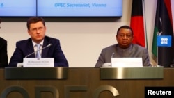 Russian Energy Minister Alexander Novak and OPEC Secretary-General Mohammed Barkindo address a news conference in Vienna on October 24.