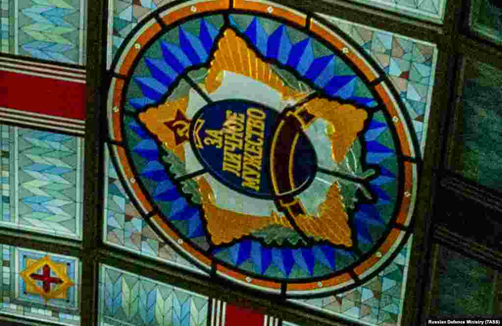A close-up of the emblem with the words &ldquo;for personal courage&rdquo; and a partially obscured communist insignia. &nbsp;