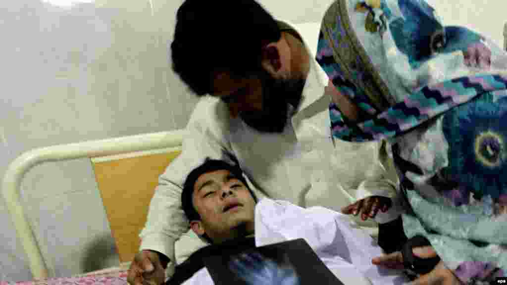 A schoolboy who was injured in a Taliban attack receives medical treatment at a hospital in Peshawar.