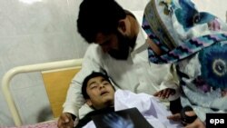 A school boy who was injured in a Taliban attack receives medical treatment at a hospital in Peshawar on December 16.